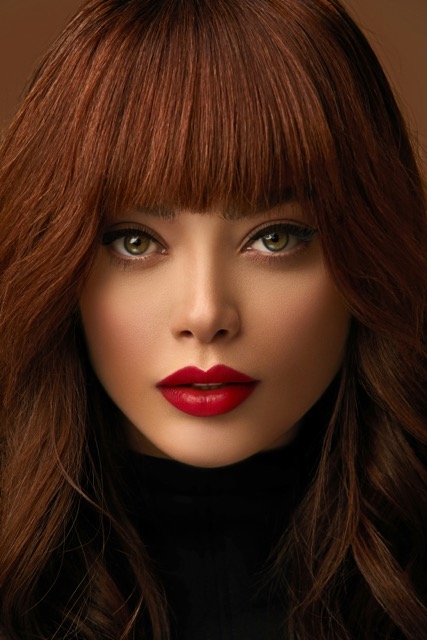 Vibrant red hair colour result — hair colouring and colour correction at Sash, Alsager