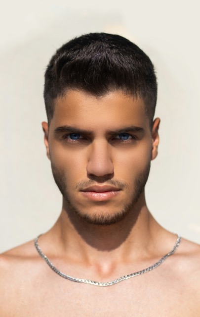Man with a sharp modern cut and beard — mens hairdressing and barbering at Sash, Alsager